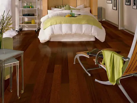 Bedroom with rich red-brown hardwood floor